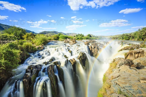 Rainbow over waterfall