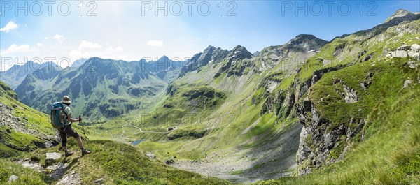 Hiker on the descent from Vetternscharte to Keinprechthutte