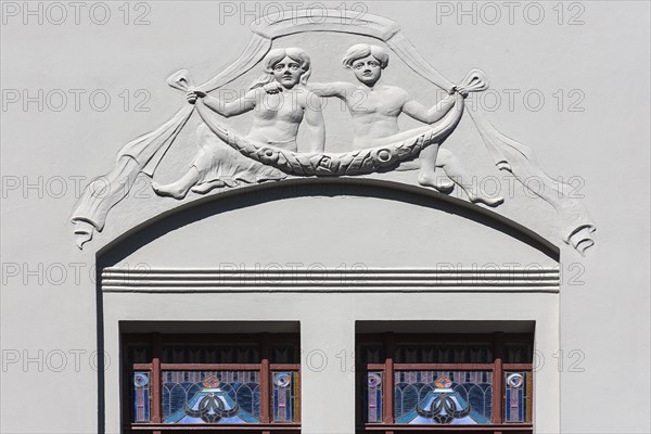 Relief and stained-glass windows on a town house