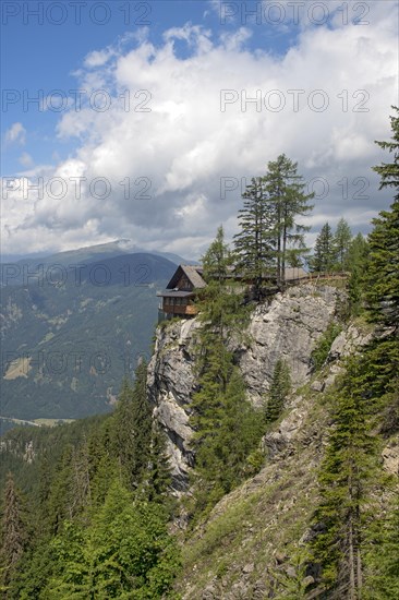 Dolomites alpine hut at a cliff