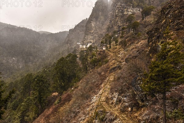 Buddhist nunnery in the mountains during snowfall