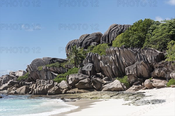 Grand Anse sandy beach with black granite rocks