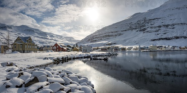 View over the village Seyoisfjorour with snow