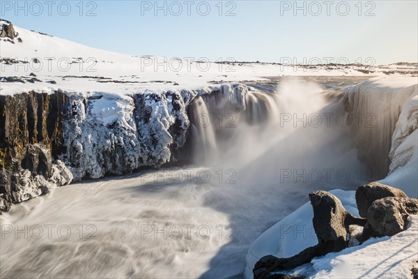 Falling water masses of the Selfoss Waterfall in Winter