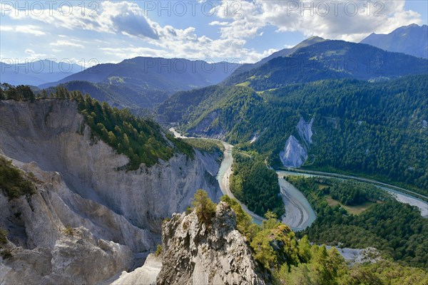 View from the viewing platform Il to the limestone cliffs at a river loop of the Vorderrhein