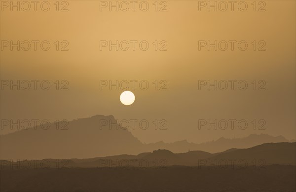 Sunset with mountain silhouette