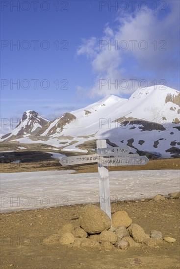 Signposts behind mountain Loomundur Fannborg and Snaekollur