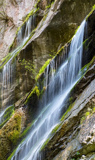 Waterfall on mossy slope