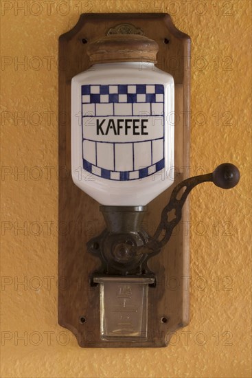 Wall mounted coffee mill