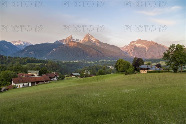 Watzmann massif and Hochkalter in the morning light in front of alpine meadows