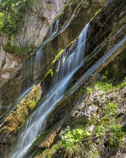 Waterfall on mossy slope