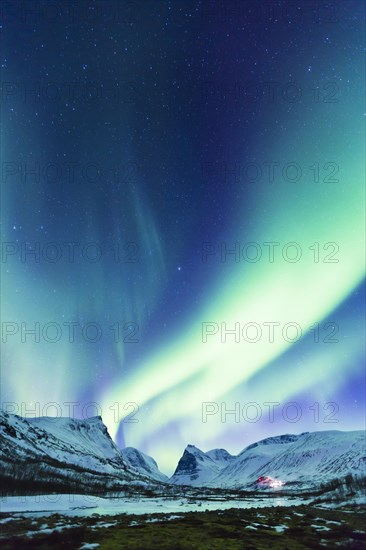 Northern Lights (Aurora borealis) over mountains