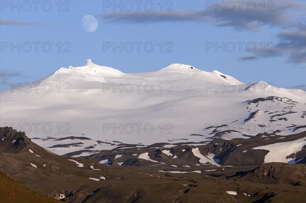 Snow-covered Snaefell volcano with Snaefellsjokul glacier and full moon