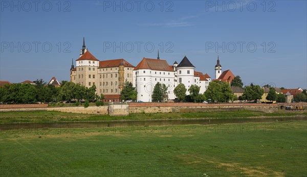 Hartenfels Castle and municipal church St.Marien with Elbe