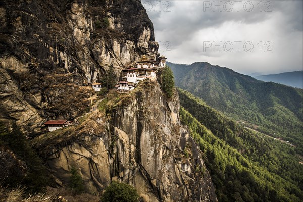 Buddhist tiger nest monastery Taktshang on steep rock face