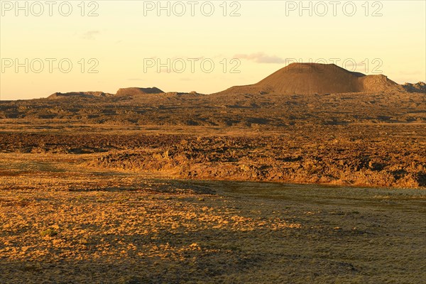 Volcanic landscape with volcanic cones in the evening sun