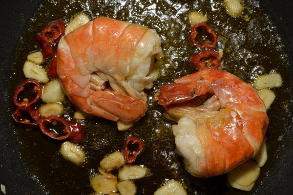 Prawns with garlic and chili in a pan