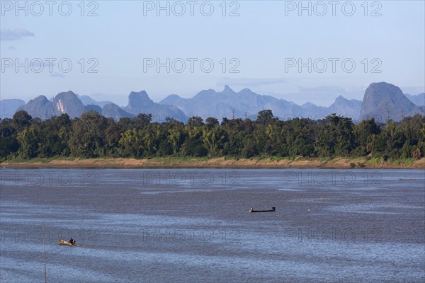 View over the border river Mekong to karst mountains in Laos