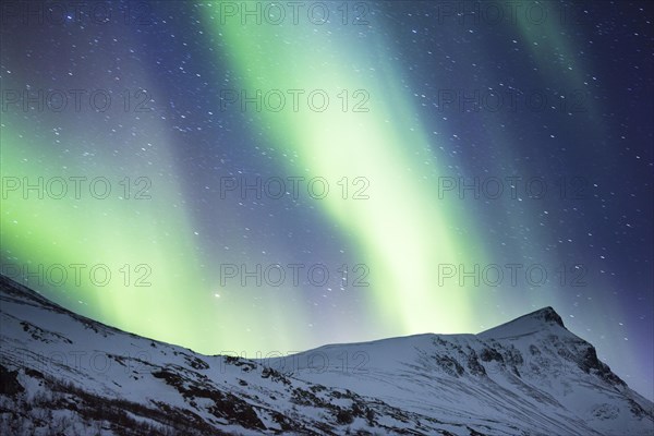 Northern Lights (Aurora borealis) over mountains