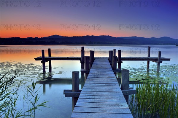Wooden pier during dawn at Pfaffikersee