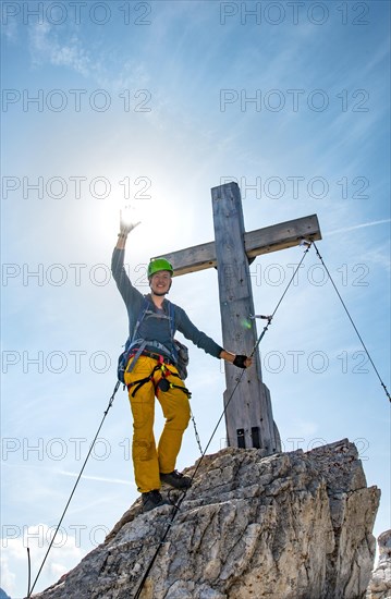 Walker at the summit cross of the Paternkofel