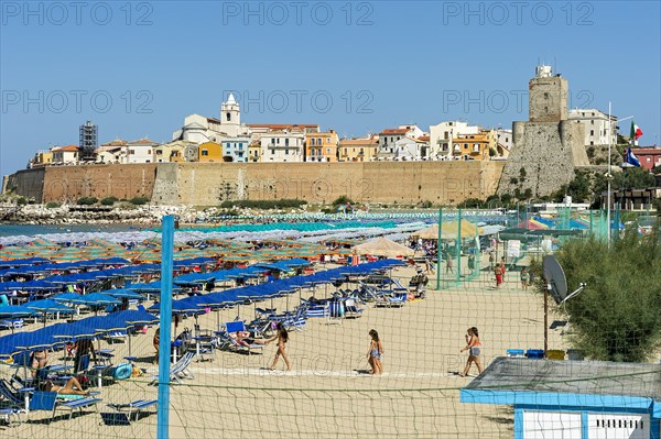 View over the beach to the Old Town with Cattedrale San Basso and Castello Svevo