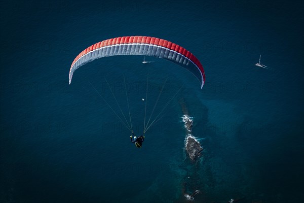 Paraglider over the Atlantic Ocean near La Caleta