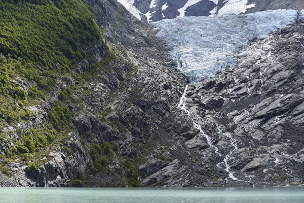 Melting glacier with lake and forest