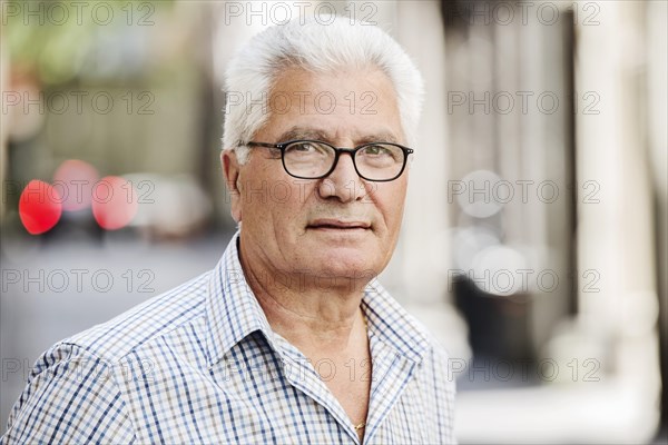 Grey-haired senior in the city