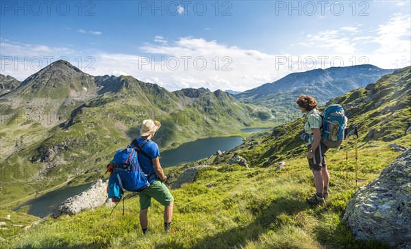 Hikers look down into the valley on the Giglachsee lakes