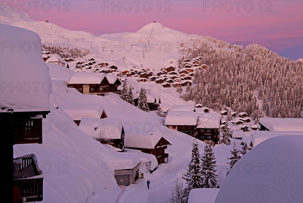 Village view snow-covered at dusk