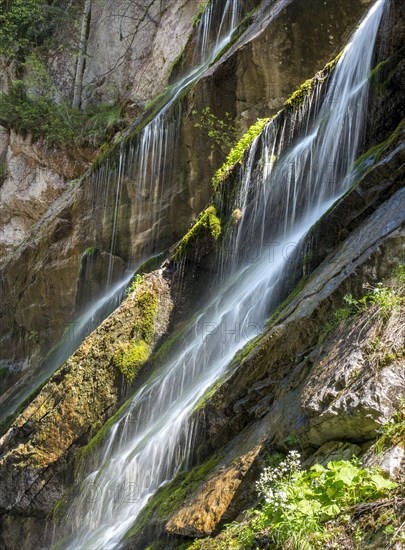 Waterfall on mossy slope