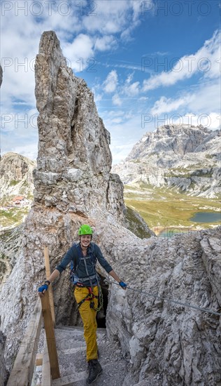 Hiker on the via ferrata to Paternkofel