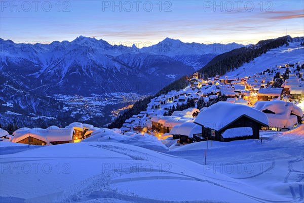 View of the snow-covered village overlooking the Rhone valley towards Dom 4545m