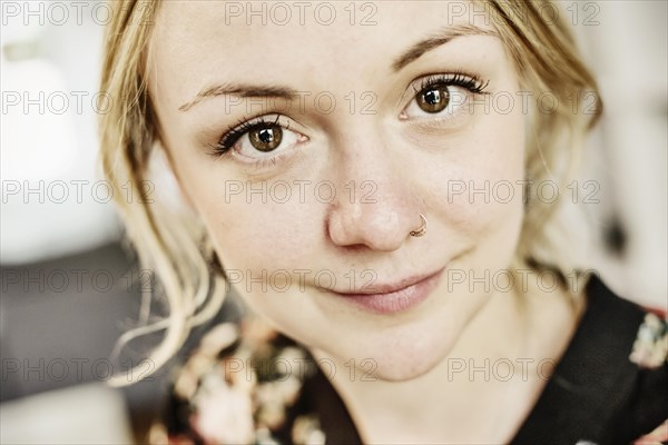 Young woman with nose piercing