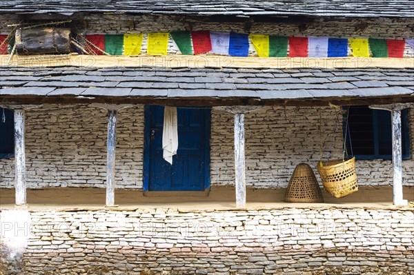 Cradle hanging in front of a house