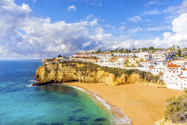 Wide sandy beach and white architecture of charming Carvoeiro