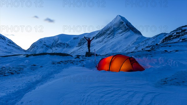 Tent with person in the snow