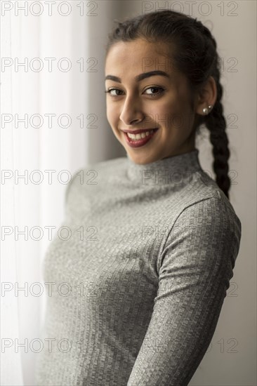 Portrait of a young woman with pigtails