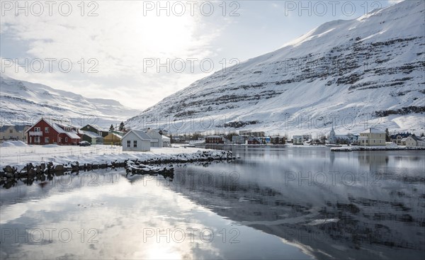 View over the village Seyoisfjorour with snow