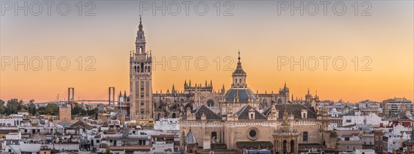 City view with views of La Giralda and Iglesia del Salvador at sunset