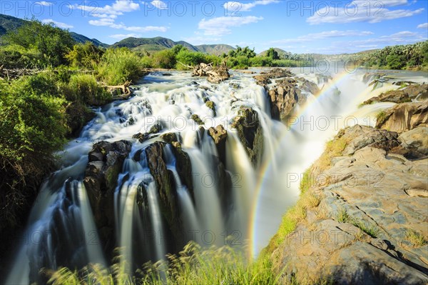 Rainbow over waterfall