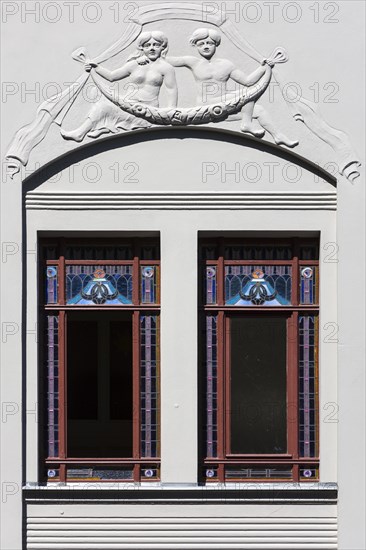 Relief and stained-glass windows on a town house