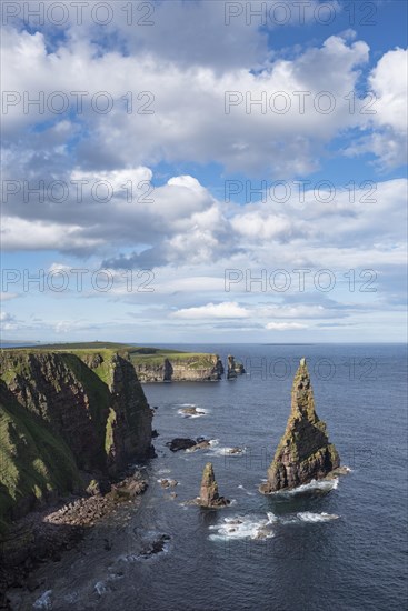 Rugged coastal landscape with the rock spikes Duncansby Stacks
