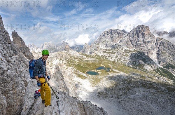 Hiker on the via ferrata to the Paternkofel