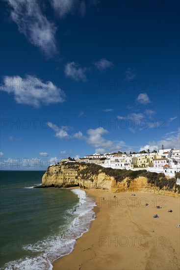 Bay with beach and colourful houses