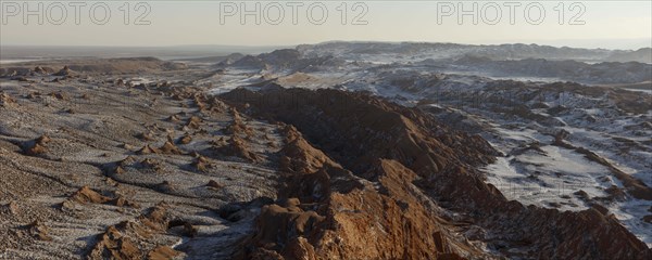 Bizarre red rock formations with white salt