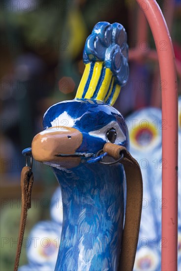 Peacock head of a nostalgic children's carousel