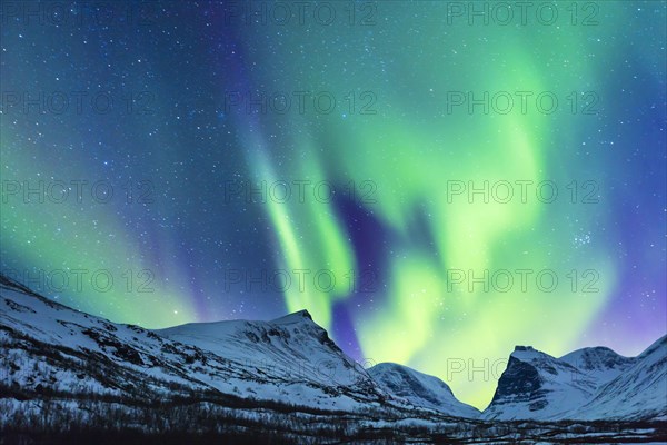 Northern Lights (Aurora borealis) over mountains