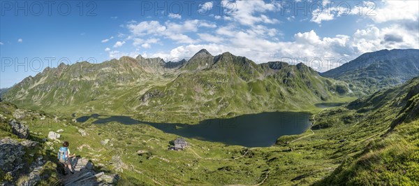 Hiker on the way to the mountain hut Ignaz-Mattis-Hutte